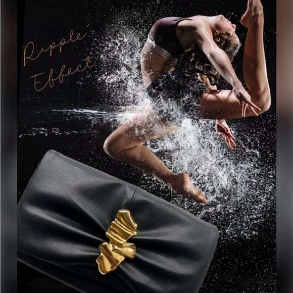 Italian leather clutch with Gold Ripple hardware with detachable chain.